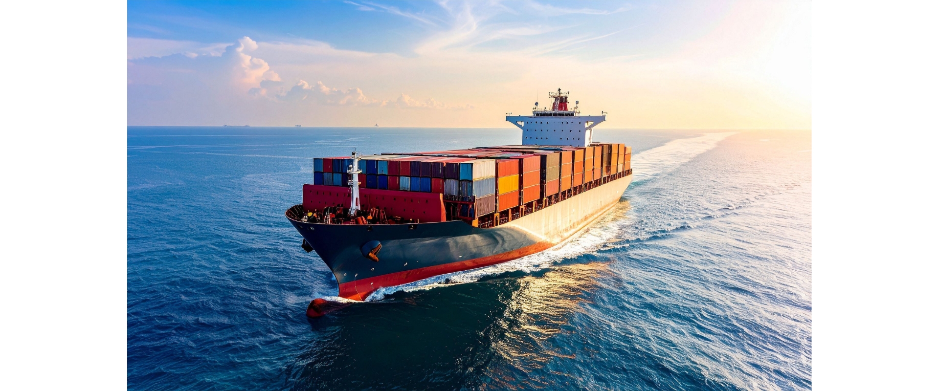Container ship at sunset on open sea